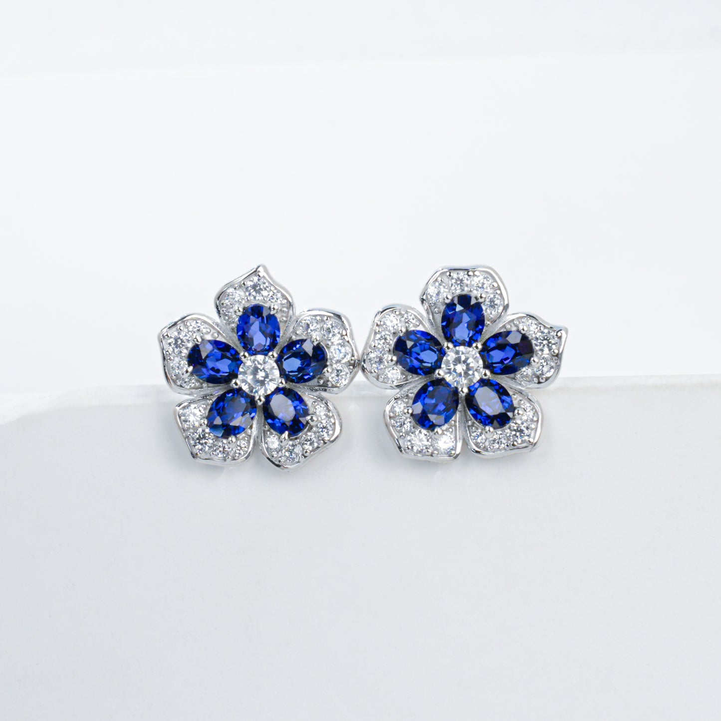 925 Sterling Silver Flower Stud Earrings, Oval Cut Lab Grown Blue Sapphire Earrings with Pave CZ